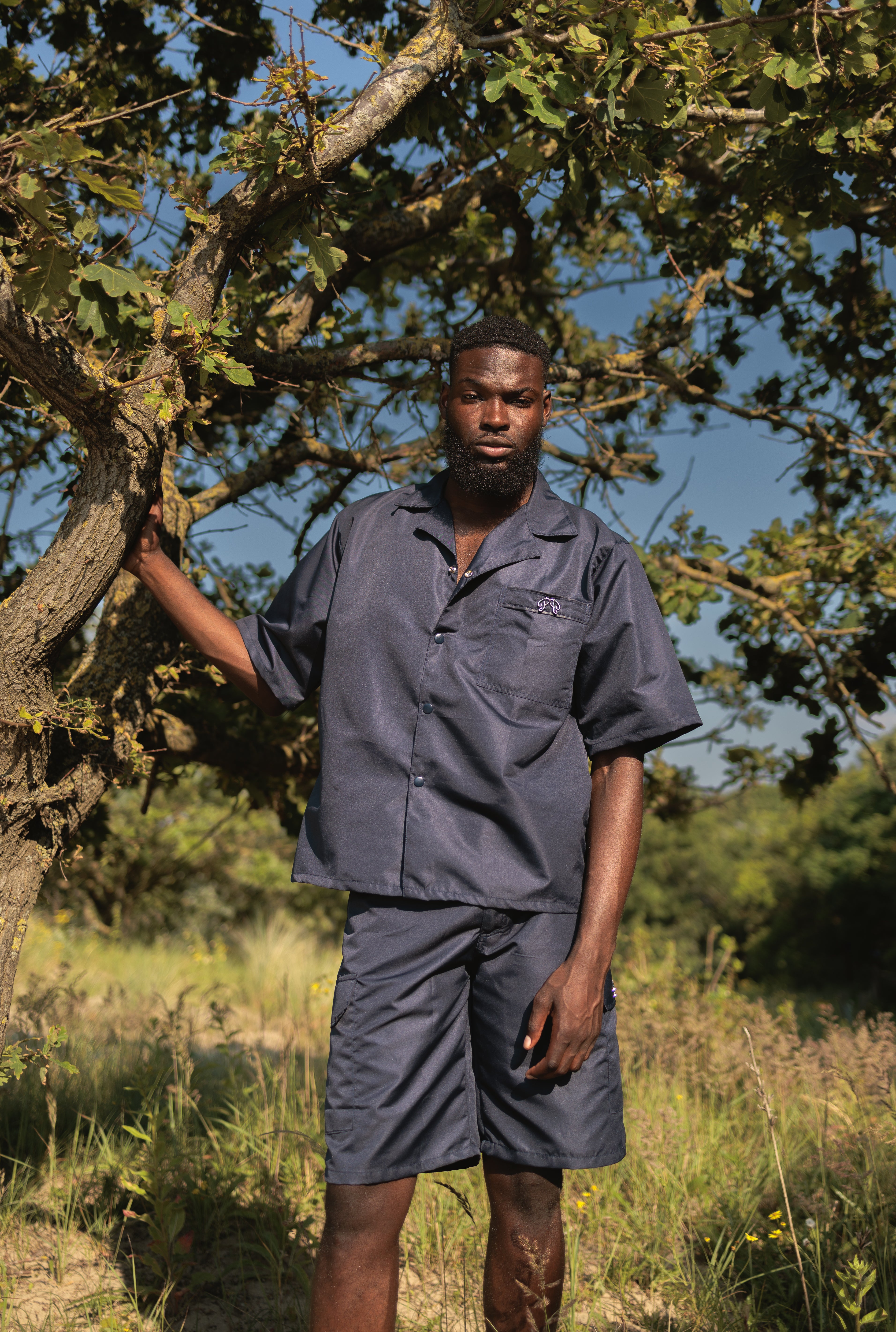 Picou Dark (marine) blue Nylon Short offers a loose fit and feature two large side pockets and belt loops with a metal logo. The shorts come with a slightly pleated front and boast a trendy, casual design, making them perfect for a special occasion or relaxed wear.