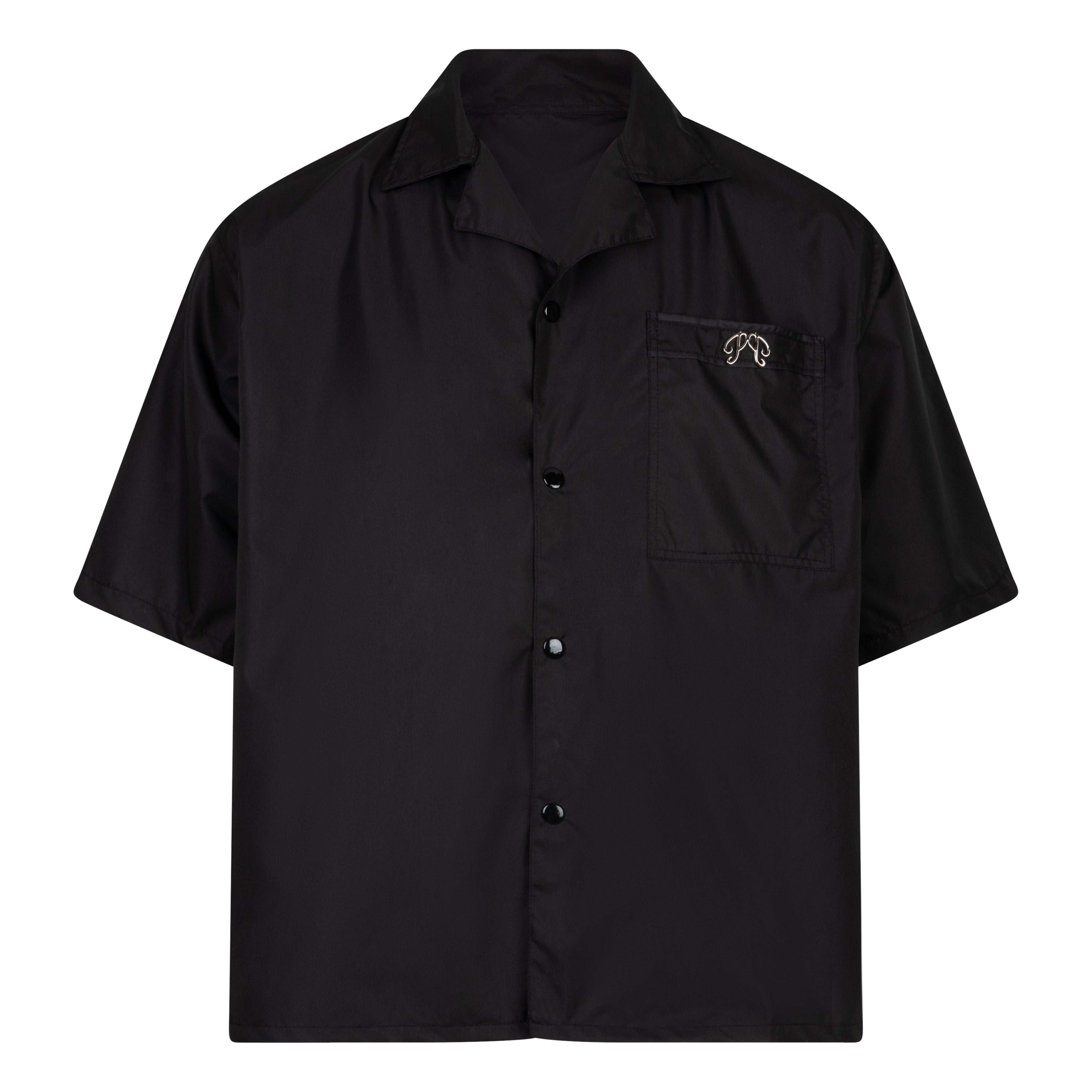 The Picou Nylon shirt in black is a short-sleeve button-up with a notched collar and a front pocket on the left chest. The pocket features a small metal tag design with intertwined letters in silver. This casual shirt offers a relaxed fit and is crafted from lightweight fabric, ideal for fashion-forward individuals seeking quality.